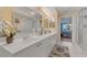 Bathroom featuring double sinks, shower, and adjacent bedroom at 4631 S Atlantic Ave # 8102, Port Orange, FL 32127