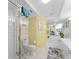 Bright bathroom featuring a glass shower, tile floors, and coordinated decor at 4631 S Atlantic Ave # 8102, Port Orange, FL 32127