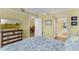 Bright bedroom with a dresser, tv and beautiful furnishings throughout at 4631 S Atlantic Ave # 8102, Port Orange, FL 32127