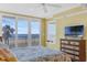 Bright bedroom with balcony access offering stunning ocean views and a peaceful coastal vibe at 4631 S Atlantic Ave # 8102, Port Orange, FL 32127