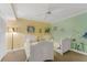 bedroom with two twin beds and decorative wall art at 4631 S Atlantic Ave # 8102, Port Orange, FL 32127