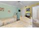 Charming bedroom featuring two twin beds and a ceiling fan at 4631 S Atlantic Ave # 8102, Port Orange, FL 32127