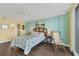 Stylish bedroom featuring a comfortable bed, rocking chair, and access to a private balcony with ocean views at 4631 S Atlantic Ave # 8102, Port Orange, FL 32127