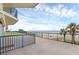 Spacious condo balcony with palm tree and ocean views, perfect for enjoying outdoor living at 4631 S Atlantic Ave # 8102, Port Orange, FL 32127