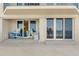 Relaxing condo patio with seating area, offering ocean views and access to the beach at 4631 S Atlantic Ave # 8102, Port Orange, FL 32127