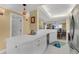 Kitchen featuring white countertops and cabinets, seamlessly connected to the dining and living areas at 4631 S Atlantic Ave # 8102, Port Orange, FL 32127