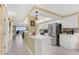 Updated kitchen with white cabinets and stainless steel appliances, seamlessly connected to living space at 4631 S Atlantic Ave # 8102, Port Orange, FL 32127