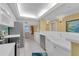 Bright eat-in kitchen with white cabinetry, stainless appliances, and tile flooring at 4631 S Atlantic Ave # 8102, Port Orange, FL 32127