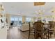 Living area featuring wood-look floors, chandelier, and a view of the Gulf at 4631 S Atlantic Ave # 8102, Port Orange, FL 32127