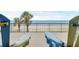 Relaxing patio view with chairs overlooking the beach and the Atlantic Ocean at 4631 S Atlantic Ave # 8102, Port Orange, FL 32127
