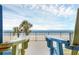 Inviting patio view with Adirondack chairs overlooking the beach and the Atlantic Ocean at 4631 S Atlantic Ave # 8102, Port Orange, FL 32127