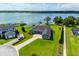 Stunning aerial view of lakefront home with lush lawn, private dock, and beautiful landscaping at 5005 Shore Side Dr, Lakeland, FL 33812