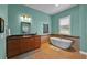 Stylish bathroom with soaking tub, tile floors, and granite countertops at 5005 Shore Side Dr, Lakeland, FL 33812
