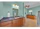 Bright bathroom with double vanities, soaking tub, and walk-in shower at 5005 Shore Side Dr, Lakeland, FL 33812
