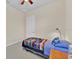 Inviting bedroom featuring a comfortable bed, a window, and neutral colored walls at 5005 Shore Side Dr, Lakeland, FL 33812