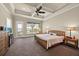 Comfortable bedroom with coffered ceiling, fan, and abundant natural light at 5005 Shore Side Dr, Lakeland, FL 33812