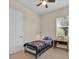 Inviting bedroom featuring a comfortable bed, a window, and neutral colored walls at 5005 Shore Side Dr, Lakeland, FL 33812