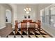 Traditional dining room with wood table, patterned rug, and natural light at 5005 Shore Side Dr, Lakeland, FL 33812