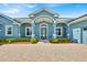 Front entry featuring brick pavers and a covered entryway at 5005 Shore Side Dr, Lakeland, FL 33812
