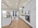 Bright kitchen with white cabinets, stainless appliances, and hardwood floors at 5005 Shore Side Dr, Lakeland, FL 33812