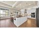 Modern kitchen with stainless steel appliances and a large island with breakfast seating at 5005 Shore Side Dr, Lakeland, FL 33812
