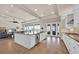 Eat-in kitchen featuring white cabinets and an island with a breakfast bar at 5005 Shore Side Dr, Lakeland, FL 33812