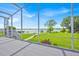 Enjoy stunning lake views from the screened lanai overlooking a manicured lawn at 5005 Shore Side Dr, Lakeland, FL 33812