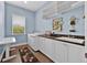 Functional laundry room featuring modern appliances, ample counter space, and a window at 5005 Shore Side Dr, Lakeland, FL 33812
