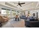 Bright living room featuring large windows, hardwood floors, and neutral walls at 5005 Shore Side Dr, Lakeland, FL 33812