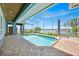 Beautiful pool with screened enclosure and clear blue water, ideal for recreation and leisure at 5005 Shore Side Dr, Lakeland, FL 33812
