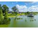 Beautiful lakefront homes with private docks and lush green lawns on a sunny day at 5005 Shore Side Dr, Lakeland, FL 33812