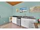 Convenient wet bar area with stainless steel mini fridge and sink on the enclosed lanai at 5005 Shore Side Dr, Lakeland, FL 33812