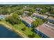 Waterfront townhomes featuring lush landscaping, well-maintained lawns, and ample parking at 517 Wilton Cir, Sanford, FL 32773