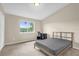 Bedroom with neutral walls, carpet flooring, and a window view at 517 Wilton Cir, Sanford, FL 32773