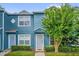 Charming two-story home with a well-manicured front lawn and blue exterior paint at 517 Wilton Cir, Sanford, FL 32773