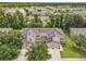 An aerial view of the exterior elevation reveals the large driveway and attached garages of this townhome at 533 Mount Olympus Blvd, New Smyrna Beach, FL 32168