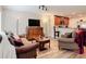 An open-concept view of the living room and kitchen area, laminate flooring throughout the space at 533 Mount Olympus Blvd, New Smyrna Beach, FL 32168
