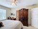 Comfortable main bedroom featuring a ceiling fan, a large wardrobe, and an office space at 533 Mount Olympus Blvd, New Smyrna Beach, FL 32168
