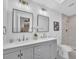 Bathroom boasts double sinks, modern mirrors, and a tiled stand up shower at 5460 Se 28Th St, Ocala, FL 34480