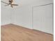 Spacious bedroom featuring wood-look flooring and ample closet space at 5460 Se 28Th St, Ocala, FL 34480
