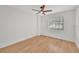 This bedroom is enhanced by natural light and wood-look flooring at 5460 Se 28Th St, Ocala, FL 34480