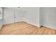 Well-lit bedroom showcasing wood-look flooring and closet at 5460 Se 28Th St, Ocala, FL 34480
