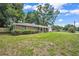 Charming one-story home features a spacious lawn and a red brick exterior at 5460 Se 28Th St, Ocala, FL 34480