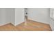 Hallway with wood flooring and a glimpse of the bedroom at 5460 Se 28Th St, Ocala, FL 34480