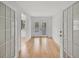 Hallway with wood flooring and double doors leading to the backyard at 5460 Se 28Th St, Ocala, FL 34480