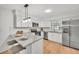 Eat-in kitchen featuring stainless steel appliances, granite countertops, and white cabinetry at 5460 Se 28Th St, Ocala, FL 34480