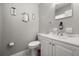 This bathroom features a single vanity, toilet, and decorative mirrors at 600 Plum Ln, Altamonte Springs, FL 32701