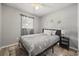 This bedroom features a ceiling fan and a window that provides natural light at 600 Plum Ln, Altamonte Springs, FL 32701