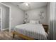 Bedroom featuring a bed with striped bedding and minimalist decor at 600 Plum Ln, Altamonte Springs, FL 32701