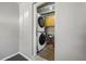 Laundry area featuring a stackable washer and dryer and overhead storage at 600 Plum Ln, Altamonte Springs, FL 32701